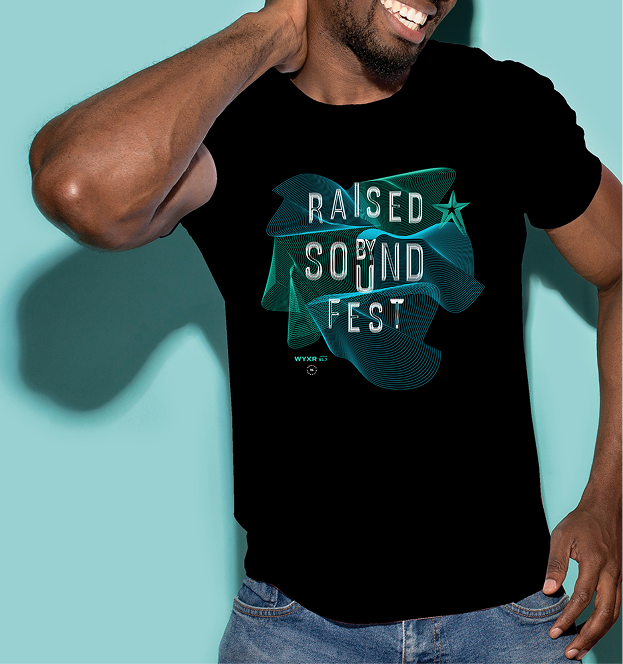 Man modeling a black Raised By Sound Fest tee with teal topographic-line artwork and WYXR 91.7 logo.