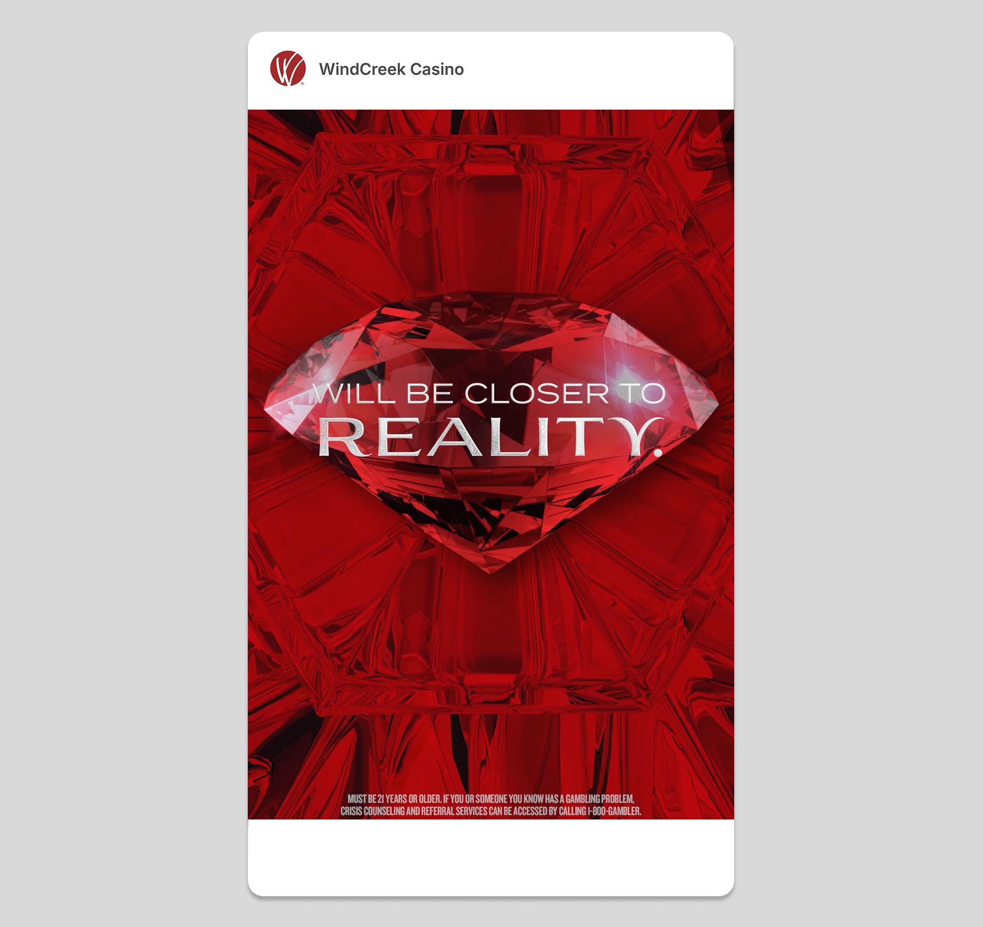 Mobile ad featuring a large red diamond with the text 'WILL BE CLOSER TO REALITY' over a red geometric background.